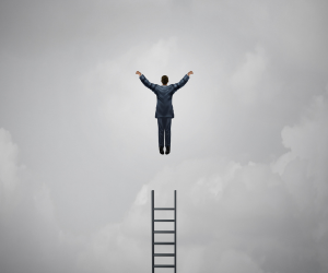 Image of person leaping from a ladder to reach their proverbial goals.